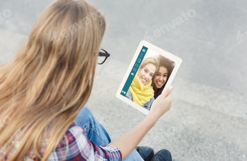 Preview: Young woman having video call with her multiracial girlfriends