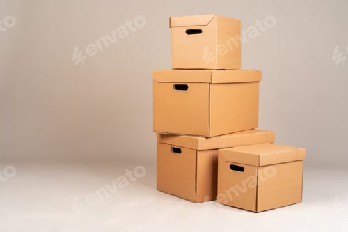 Preview: Pile of brown moxing boxes on grey background