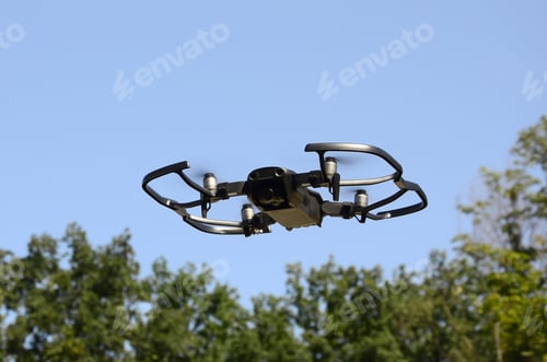 Preview: Drone with photocamera take off from land and flying for take aerial photo