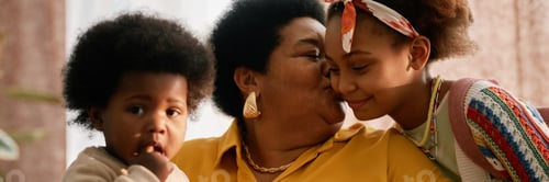 Preview: Header Image of Black Senior Granny Kissing Kids at Home
