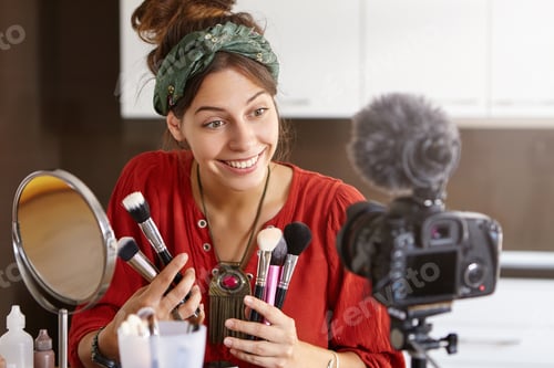 Preview: Cosmetology and online video translation concept. Female cosmetologist blogging before breakfast, ha