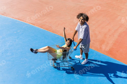 Preview: Multiracial group of young friends bonding outdoors