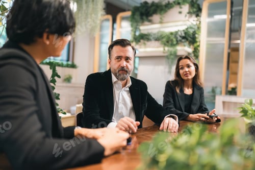 Preview: Business Meeting Team Analyzing Financial Data and Marketing Report in Corporate Office