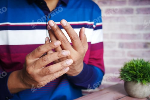 Preview: man suffering pain in hand close up