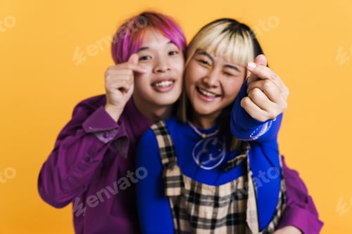 Preview: Asian couple smiling while rubbing their fingers together