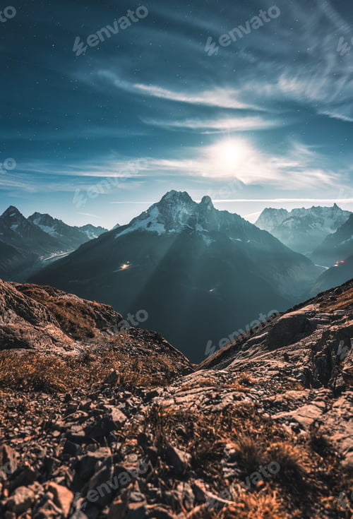 Preview: Mont Blanc massif with rock mountain and moonlight in night sky at Lac Blanc, France