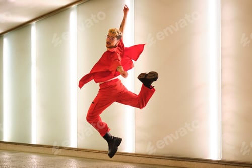 Preview: Young man with dyed hair and red clothes is dancing urban dance