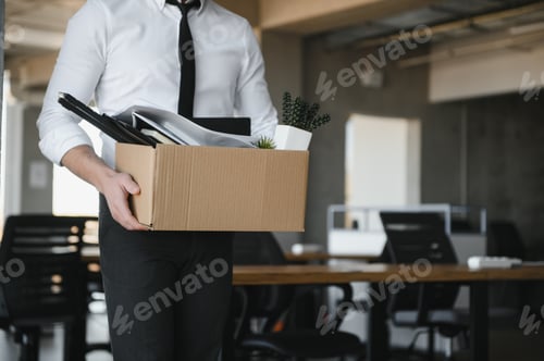 Preview: Close-up Of A Businessperson Carrying Cardboard Box During Office Meeting