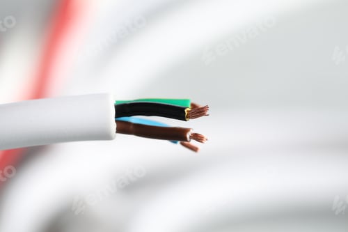 Preview: Colorful electrical wire on blurred background, closeup. Space for text