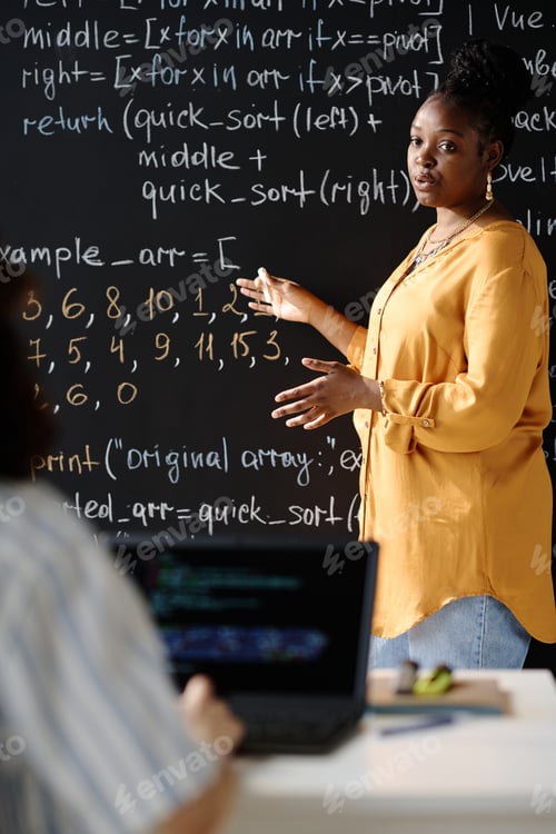 Preview: Tutor teaching IT to student at lesson
