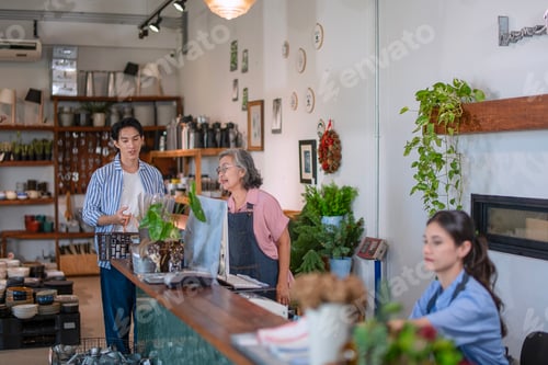 Preview: Mother, son and daughter are working at their DIY store.