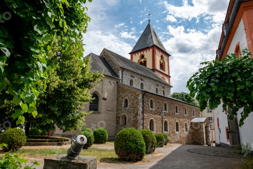 Preview: the church and a cannon in the town of erpel in germany