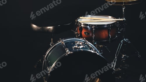 Preview: Drums on a dark background, part of a drum kit.