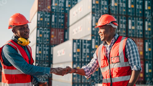 Preview: African worker handshake container teamwork safety logistics dock helmet vest smile