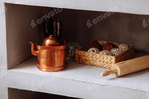 Preview: A copper kettle and other kitchen utensils lie on a shelf