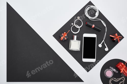 Preview: top view of gadget, gift boxes, perfume, bracelets, decorative cosmetics, earrings, earphones