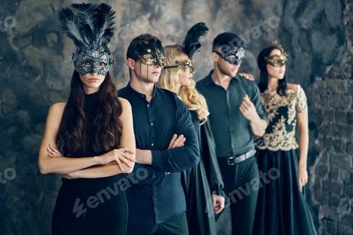 Preview: Group of people in masquerade carnival mask posing in studio