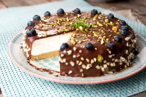 Preview: Delicious Cheesecake Topped with Chocolate and Blueberries