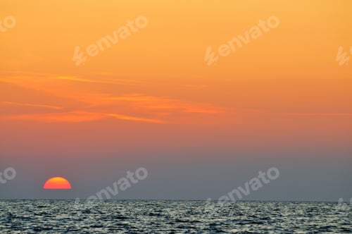 Preview: Beautiful colorful sunset over wavy waters of Black sea in Crimea
