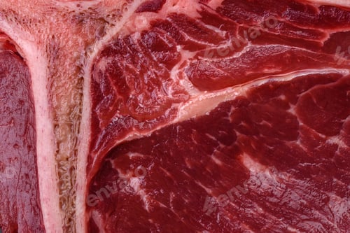 Preview: Raw juicy beef t-bone steak with salt, spices and herbs