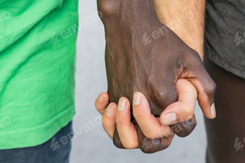 Preview: Close-up of gay couple's hands.