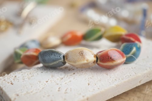 Preview: Colorful beads on a simple surface in a crafting space