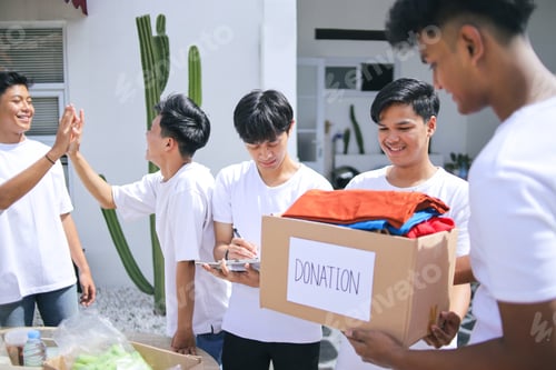 Preview: Group of People Working in Charitable Foundation, Separating and Listing Donation Stuffs