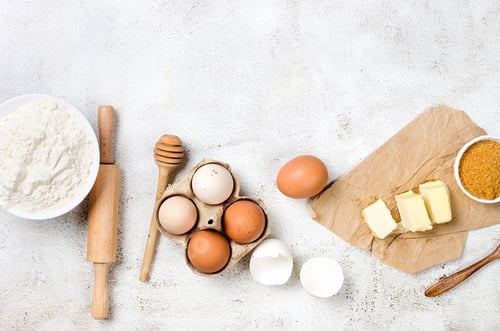 Preview: Ingredients for making dough dishes: cakes, cookies, muffins, pies on a gray background.