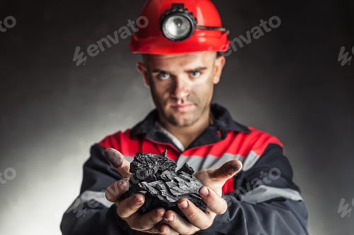 Preview: Coal miner holding lump of coal