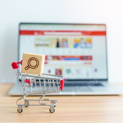 Preview: Shopping cart with Magnifying icon block and laptop computer