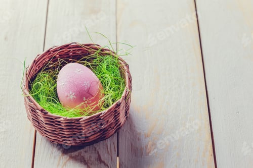 Preview: Easter eggs painted in pastel colors on white wooden background.