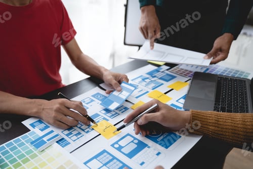 Preview: ux developers, UI designers Asian group data researchers brainstorm on tabletop mobile app interface