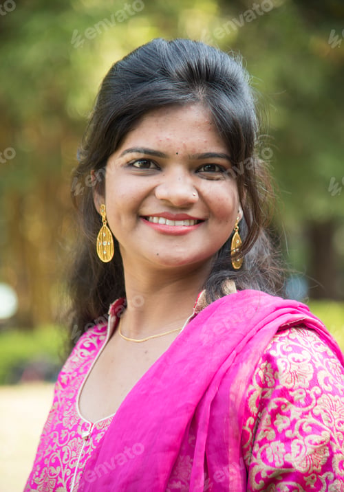 Preview: Outdoor portrait of beautiful young Indian girl in traditional dress.