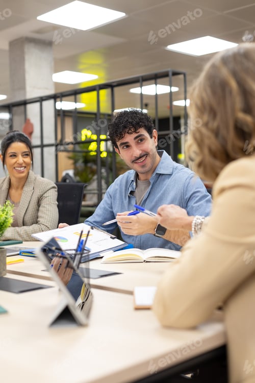 Preview: Business colleagues collaborating during a corporate meeting