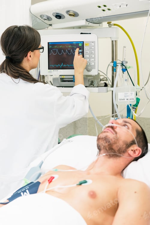 Preview: Medical doctor making ECG test in hospital.