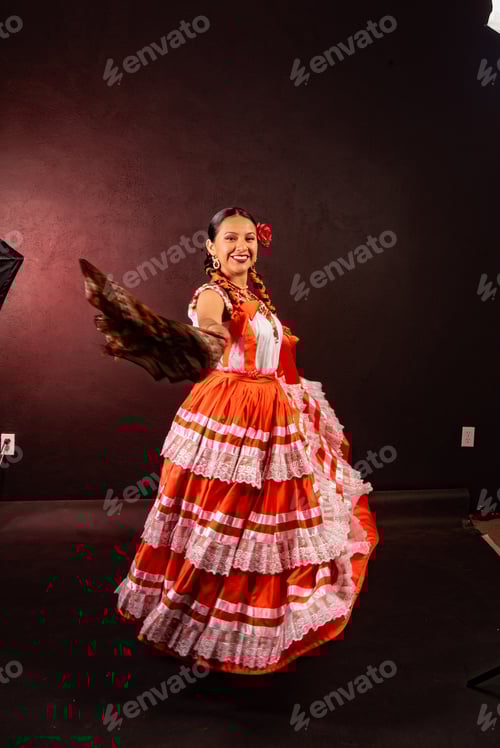 Preview: A woman in a red and white dress is dancing
