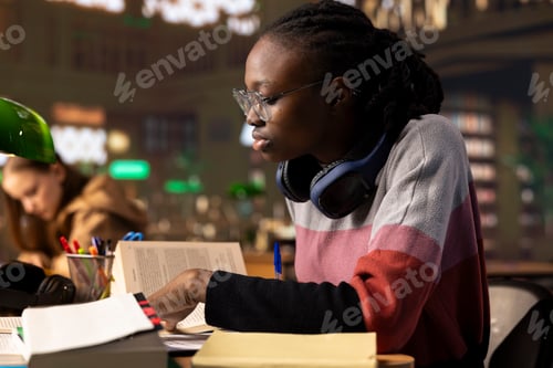 Preview: African american college student writes her bachelor degree paper