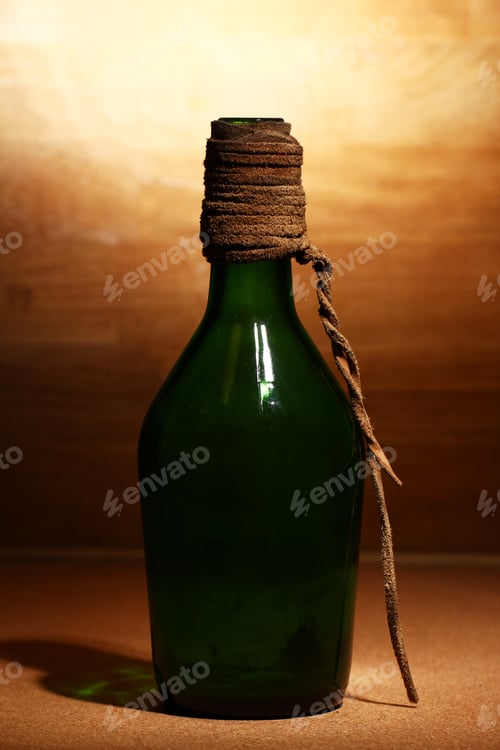 Preview: Old bottle over wooden surface