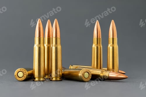 Preview: Bullets on gray background. Cartridges 7.62 caliber for Kalashnikov assault rifle closeup