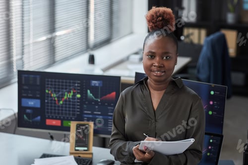 Preview: African American trader working in office
