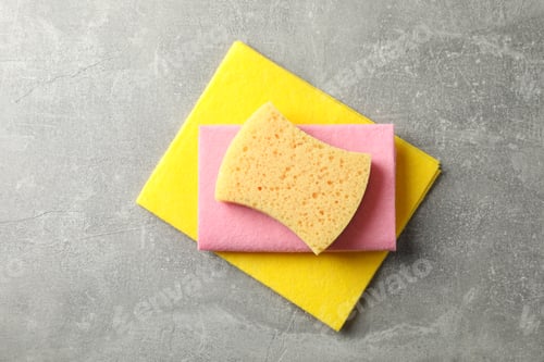 Preview: Sponges for washing dishes on grey background, top view