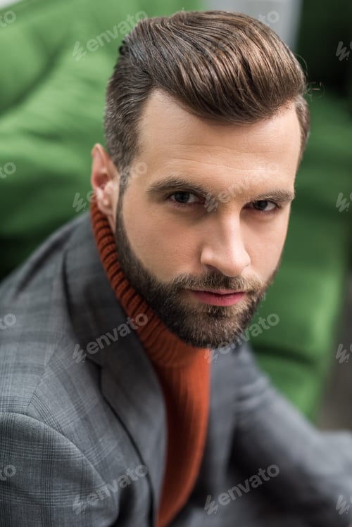 Preview: portrait of serious man in formal wear looking at camera