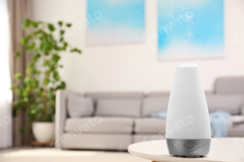 Preview: Modern essential oil diffuser on table in room. Space for text