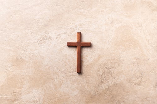 Preview: Wooden cross on marble background. Reminder of Jesus sacrifice and Christ resurrection. Easter