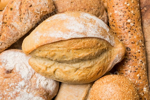 Preview: Homemade natural breads. Different kinds of fresh bread as background, top view with copy space