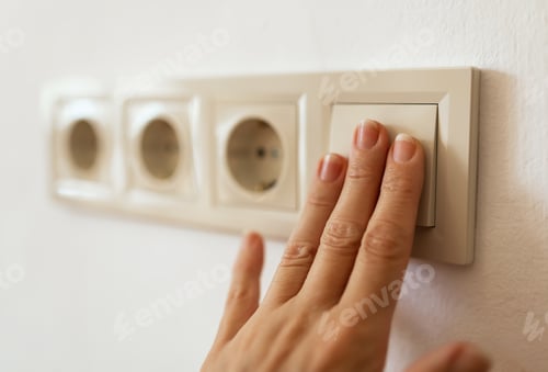 Preview: Fingers turn on or off light switch, saving energy, electricity concept