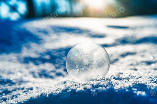 Preview: frozen soap bubble in winter on snow