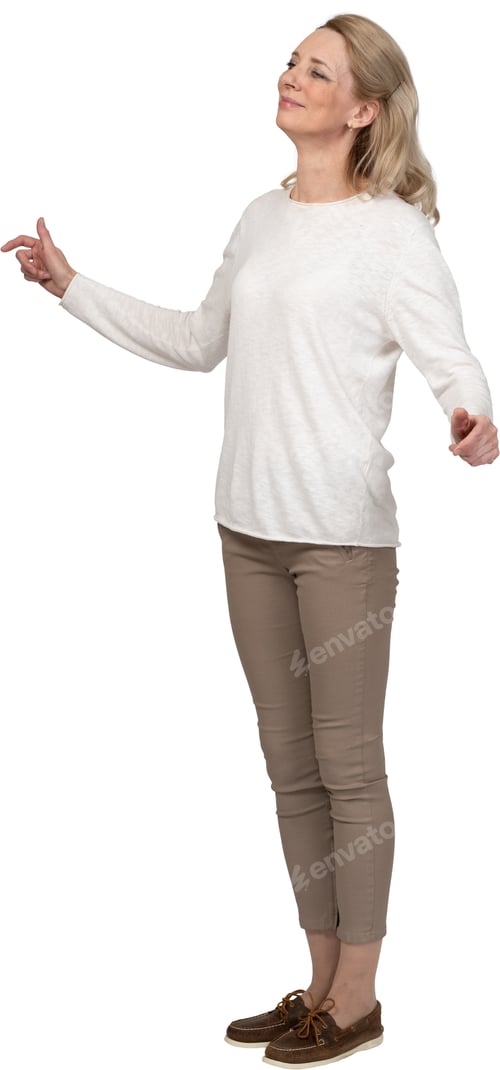 Preview: a woman in a white sweater is standing with her arms out