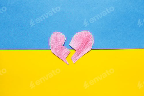 Preview: broken red heart on the ukrainian flag background