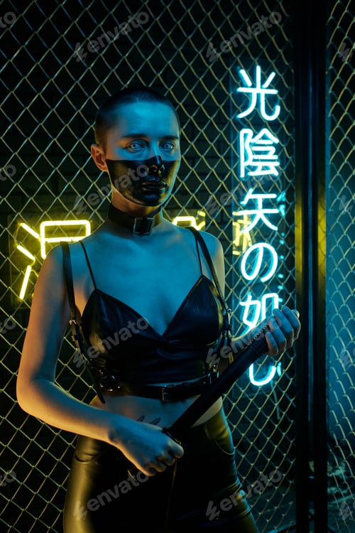 Preview: Young cyberpunk female in black leather clothes holding whip